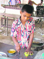 cut it out Kareem Ashraf works at a food shop.