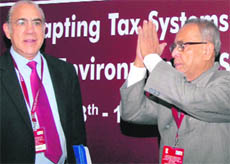 Finance Minister Pranab Mukherjee with Secretary General, OECD, Angel Gurria at a seminar in New Delhi on Tuesday.