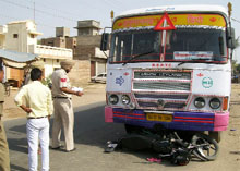 Cops inspecting the site where a Rajasthan Roadways bus hit a motorbike resulting in the death of one person.