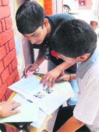 checking it out Students go through Class XI admission prospectus in Chandigarh