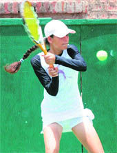 shot time A player in action during the CLTA-AITA Super Series Tennis Tournament at the CLTA sports complex in Chandigarh on Monday.