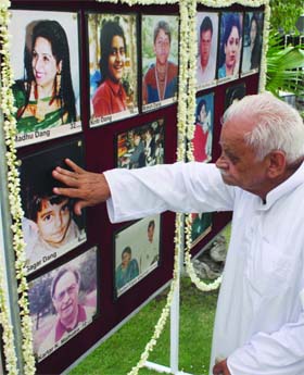 A relative of a young victim of the Uphaar tragedy remembers him in New Delhi on Monday