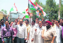 Congress workers hold a protest against the continuous felling of trees in front of the forest office in Dehradun on Monday. 