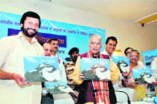 Senior BJP leader Murli Manohar Joshi releases a book written by Uttarakhand Water Resources Minister Parkash Pant (left) on Adi Kailash at a function in Dehradun on Monday. 