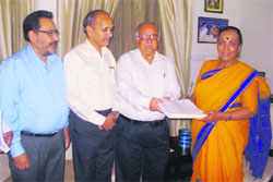 Indu Kumar Pandey, Chairman of the state Finance Commission, presents its third report to Uttarakhand Governor Margaret Alva in Dehradun on Monday.