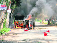The police vehicles that were burnt down by a mob at Baddi on Monday.