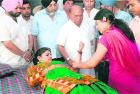 A girl donates blood during a blood donation camp organised by the Punjab Pradesh Congress Committee in Jalandhar on Sunday. 