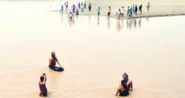 Divers and villagers search for the bodies of Tarun and Varinder, who are feared drowned in the Sutlej, near Ludhiana