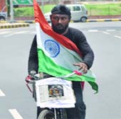 Autorickshaw driver from Andhra Pradesh Rajendra Singh who reached New Delhi on cycle on Tuesday 
