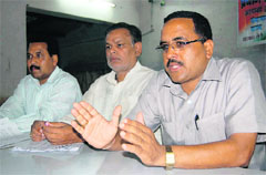 Surat Singh Negi, president of the Uttarakhand Gram Pardhan Sangathan addresses a press conference in Dehradun on Tuesday. 