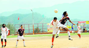Players in action in a match in the All-India Football Tournament at DS Bisht Stadium at Pithoragarh 