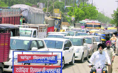 Nowhere to go Vehicles stuck in a traffic jam at Shimlapuri Chowk during a protest in Ludhiana on Tuesday.