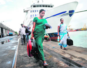 Indian passengers disembark in Colombo from a ferry that sailed from Tuticorin. 