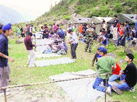 Children learn tent pitching at a summer camp near Manali. 