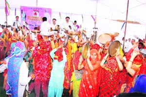 WELCOMING the gIrlchild: Women beat utensils to celebrate the birth of a girl at Mitathal village in Bhiwani district on Wednesday.