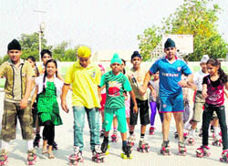 Students learn skating during a summer camp at Guru Nanak International Senior Secondary Public School in Ludhiana