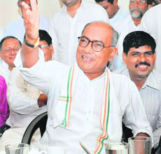 Congress general secretary Digvijay Singh shares a laugh with party workers in Bhopal 