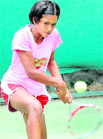 Nandini Sharma in action during the ongoing CLTA-AITA Super Series Tennis Tournament at the CLTA complex in Chandigarh on Thursday
