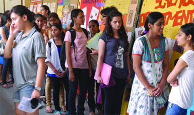 Students queue up for admission forms at Miranda House in New Delhi on Thursday.