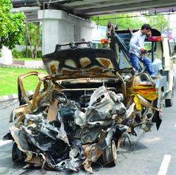 A Fiat Palio car was gutted after it caught sudden fire at Ring Road in New Delhi 