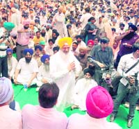 raising their voice Hira Singh Gabria leads a protest against the UPA government in Ludhiana on Thursday.