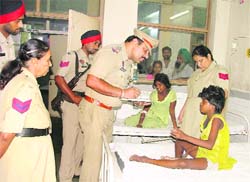 on record SHO Maninder Singh Bedi records the statement of the two freed girls at the Civil Hospital in Ludhiana on Thursday.