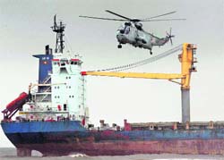 Five days after it broke free from its tow and ran aground at Mumbais Juhu beach, efforts began on Thursday to salvage MV Wisdom using Naval helicopters. Choppers began dropping heavyduty wires and other equipment on the ships deck. Once the tug reaches the spot, salvers hope to take advantage of Fridays high tide to pull out the vessel.