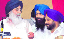 Punjab Chief Minister Parkash Singh Badal interacts with Nayagaon NAC president HS Bajwa during a function at Nayagaon 