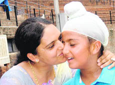 Sumitpal Singh being caressed by his mother after he won the U-12 title of the CLTA-AITA Tennis Championship in Chandigarh 