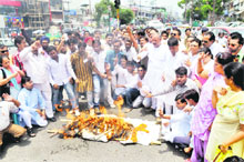 Congress workers burn an effigy of the state BJP Government in Dehradun on Friday.