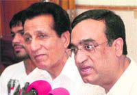 Union Sports Minister Ajay Maken (right) addresses mediapersons in Jammu on Friday. 
