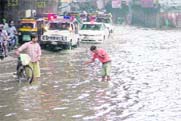 Convoy of the Chief Parliamentary Secretary stuck on a flooded road near the Clock Tower