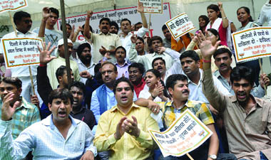 Activists of the Bharatiya Janata Yuva Morcha hold a protest against the high cut-off lists in colleges, at Jantar Mantar in New Delhi on Saturday.
