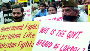 People hold a peace protest against corruption at the Rajghat in New Delhi 