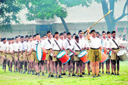 RSS volunteers perform a drill at the concluding function of a training programme in Dehradun on Saturday.