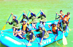 Tourists do river rafting on the Saryu.