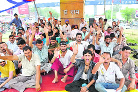 Members of the Jammu and Kashmir Peoples Front stage a protest in Jammu on Saturday. 
