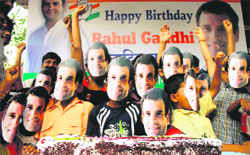 Congress activists wear masks of AICC general secretary Rahul Gandhi on the eve of his birthday, in Mumbai on Saturday. 