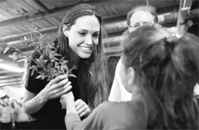  United Nations High Commissioner for Refugees Goodwill Ambassador Angelina Jolie (C) meets a young Syrian refugee girl at the Altinozu camp in the Hatay province of Turkey on Friday. Nearly 10,000 Syrians have crossed the border into Turkey fleeing a crackdown by the Damascus regime, an official source said on Saturday.