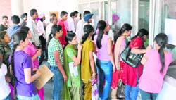Students line up to buy admission forms at Panjab University in Chandigarh