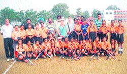 The Utah University team poses with players at the Mehar Baba Charitable Hockey Nursery Academy