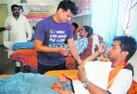 Volunteers of the Shiv Sena Yuva Morcha donate blood at a camp held at Doon Hospital in Dehradun