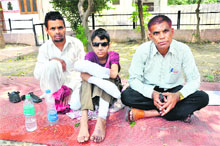 Ashiq Hussain (centre), mine blast victim, with his relatives in Jammu. 
