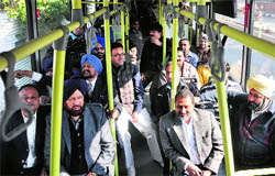 A file photo shows MC Commissioner AK Sinha, Mayor Hakam Singh Giaspura, Senior Deputy Mayor Praveen Bansal take a ride in a low-floor bus during its trial run