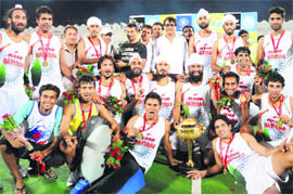 Haryana team players celebrate after winning the 1st Hockey India senior National Mens Championship at Aish Bagh stadium in Bhopal on Sunday