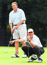 Barack Obama and US Speaker of the House John Boehner play golf on Saturday. 