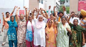 Janata Nagar residents staging demonstration outside the BMC office on Monday.