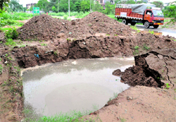 A portion of a road caved in at Sector 50 near the BSNL Society in Chandigarh