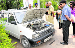 Policemen at the spot where a minor duped a man of Rs 3.5 lakh kept in a car at a petrol station in Sector 31, Chandigarh, on Monday
