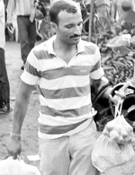 A man carries vegetables in polythene bags at Ziarkpur